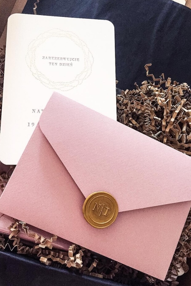 Blush pink and gold wedding invitation with envelope and wax seal