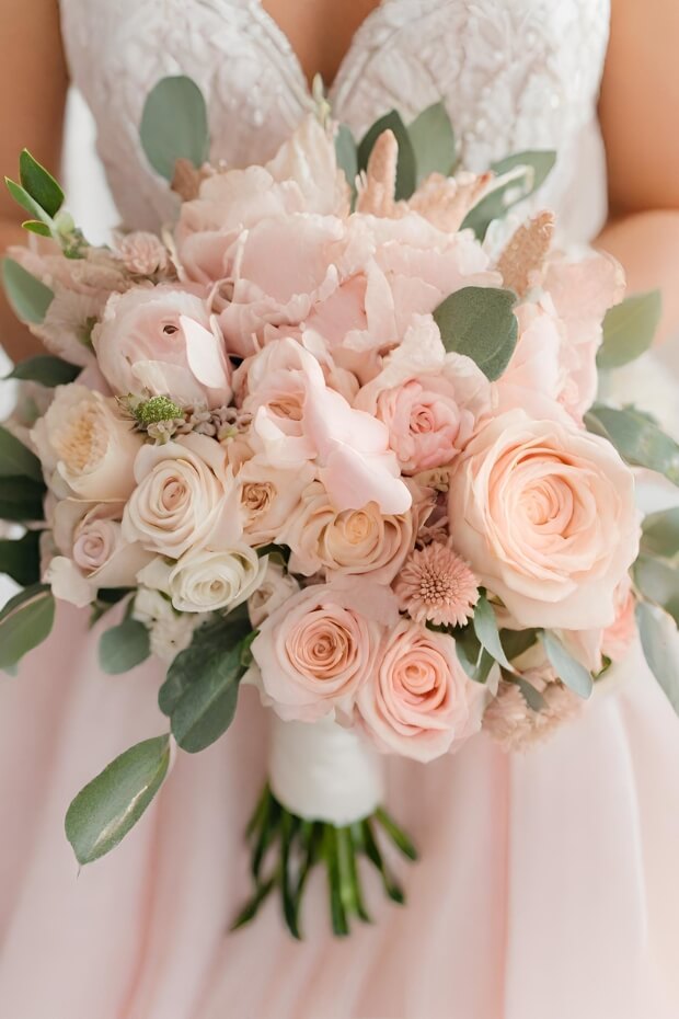 Bride holding bouquet of pink and white flowers