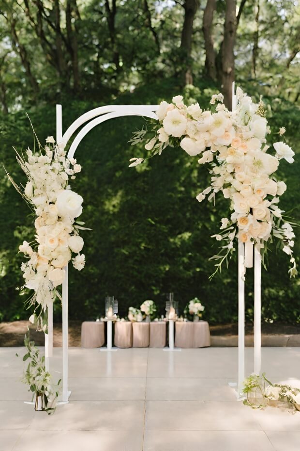 Modern metal wedding arch with white and green flowers