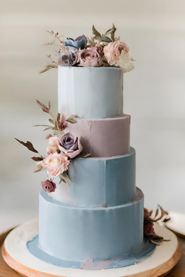 Multi-tiered Blue Wedding Cake with Purple and Pink Flowers