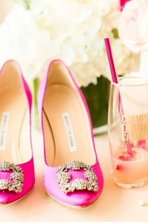 Pink shoes with gold buckle and pink drink