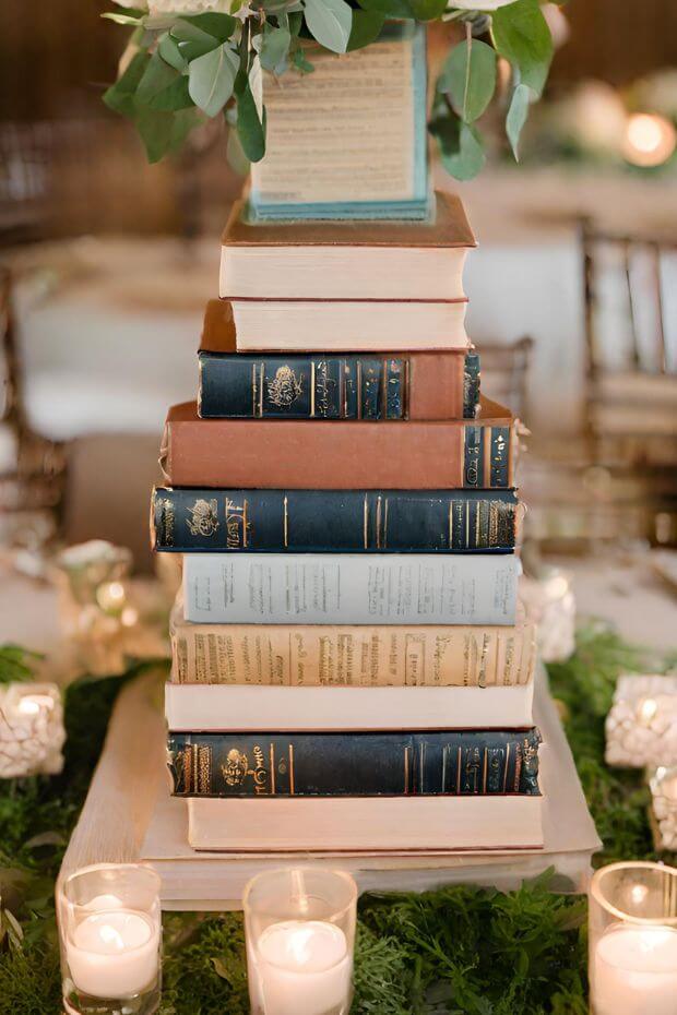 Unique wedding centerpiece with book stack and flowers