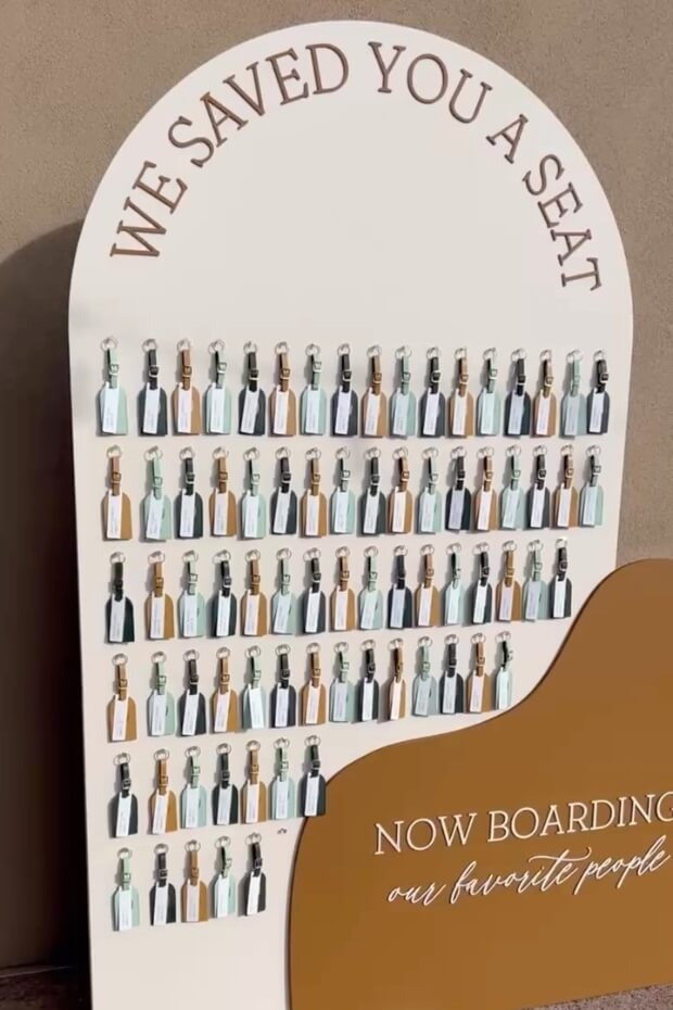 Wedding seating chart resembling airplane boarding sign
