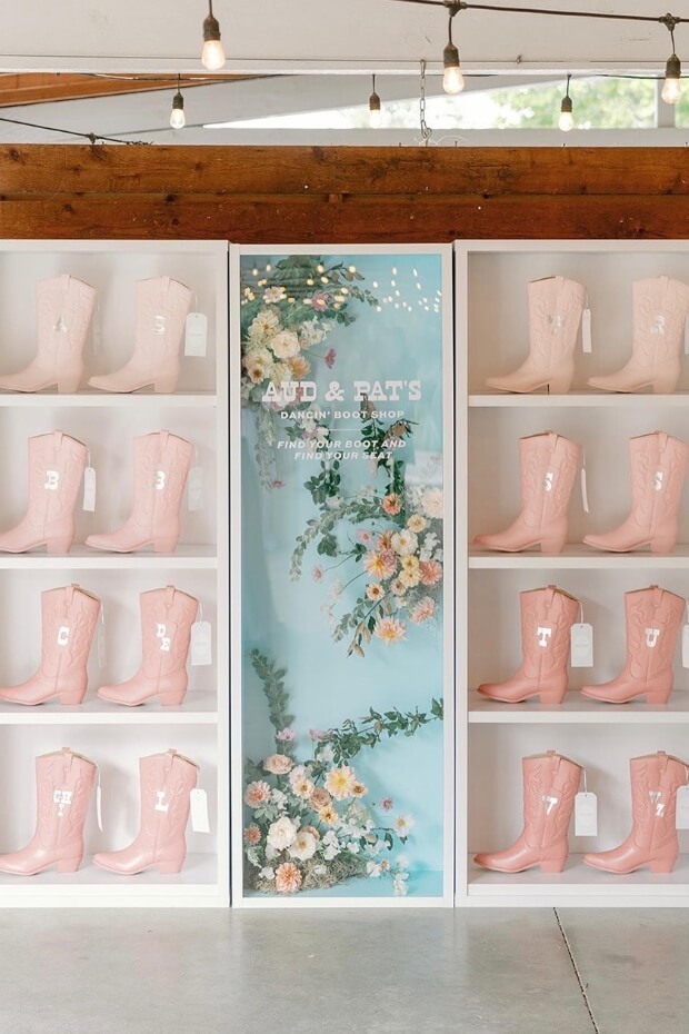 Wedding seating chart with pink dancing boots