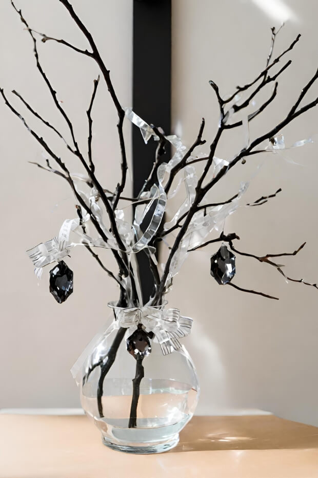 Branch and ornament centerpiece in vase