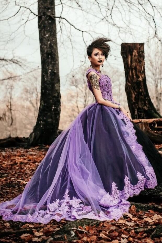 Woman in elegant purple and black dress