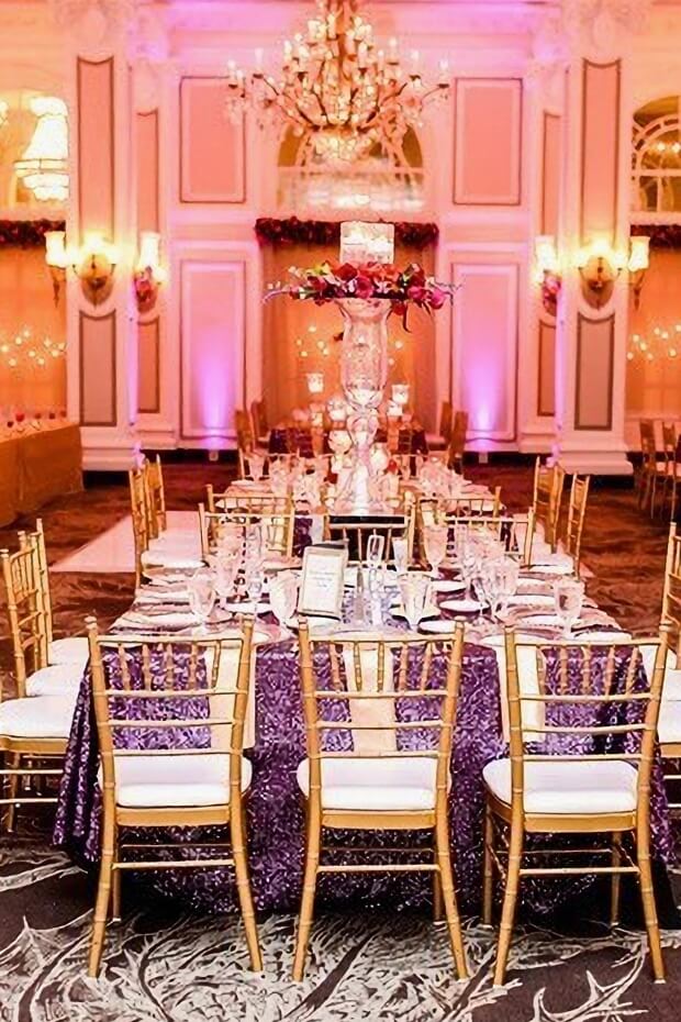 Luxurious grand ballroom with Purple and Gold Wedding Theme decorations