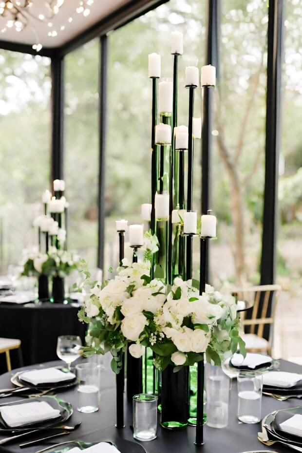 Green and white flower centerpiece on black tablecloth