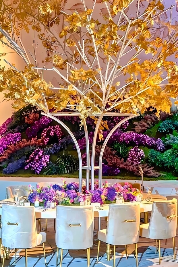 Lavish dining area with purple and gold theme and decorated tree centerpiece