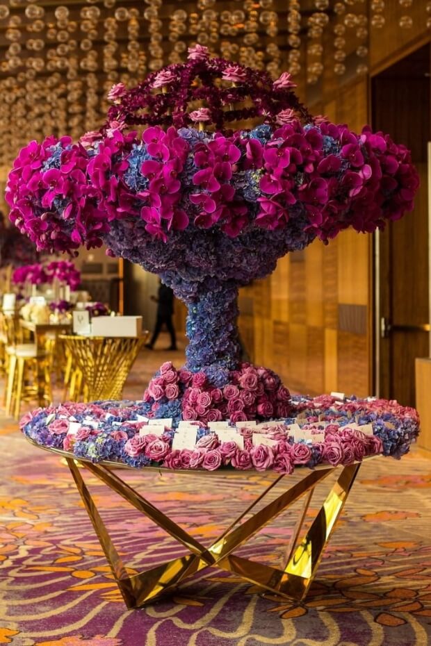 Lavish wedding display with purple and blue flowers