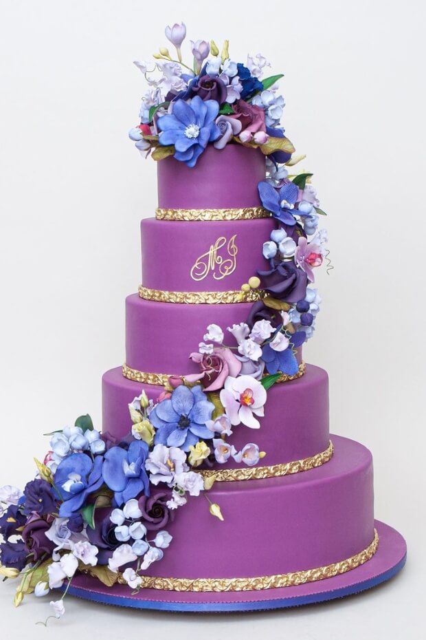 Purple wedding cake with floral decoration