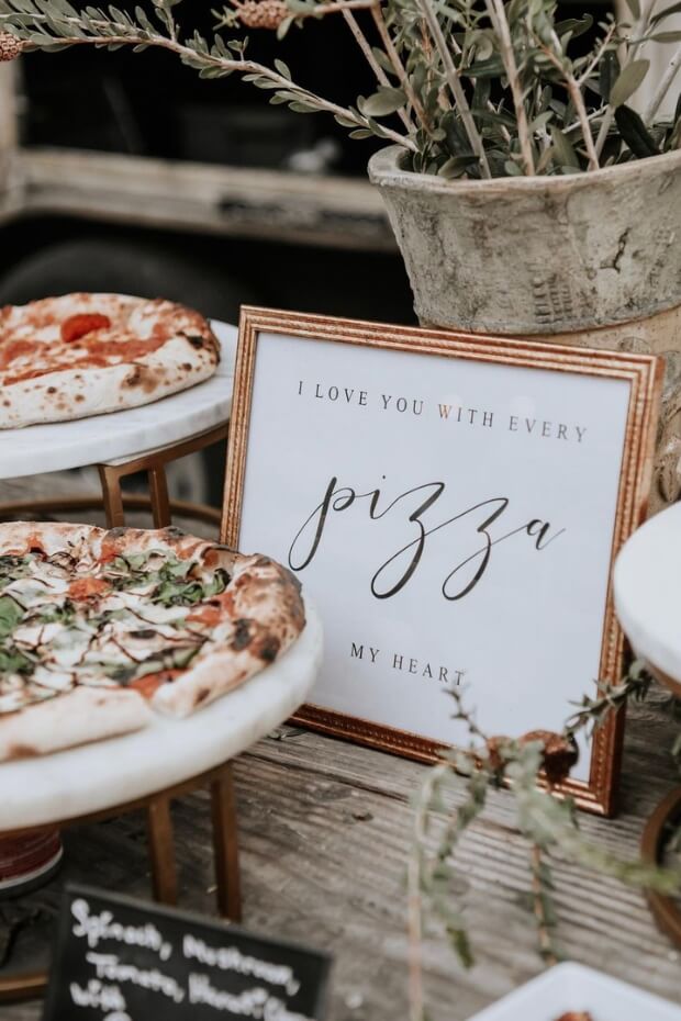 Wedding pizza bar with assorted toppings