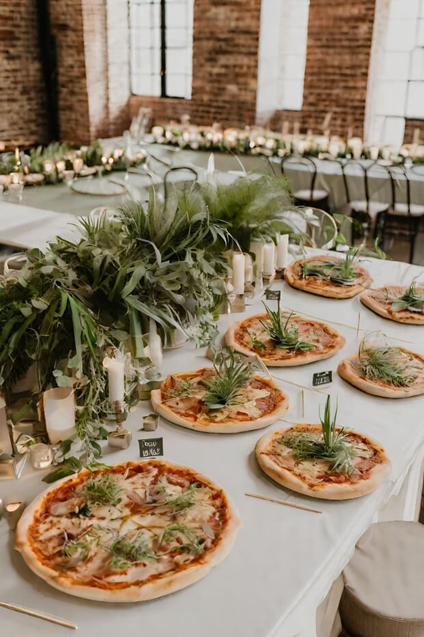 Wedding reception table with pizzas