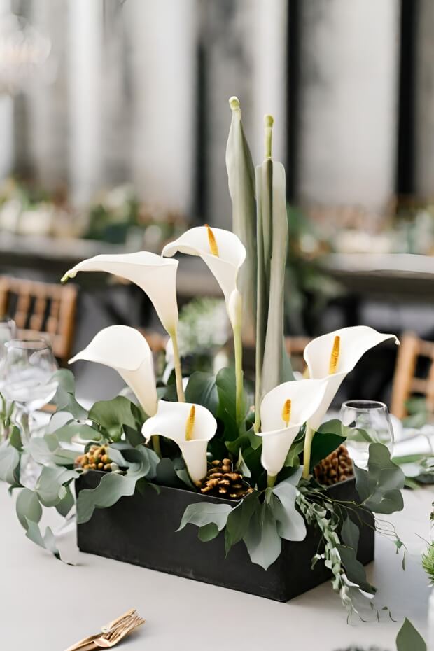White and green flower centerpiece with gold accents