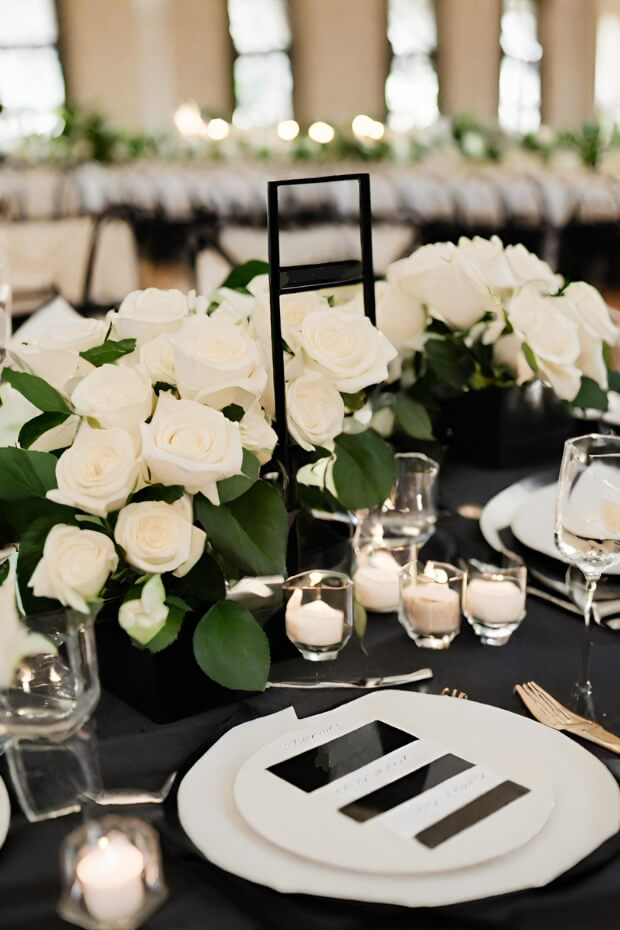 Elegant white rose and greenery centerpiece