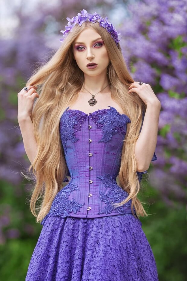 Woman in purple dress with lace overlay