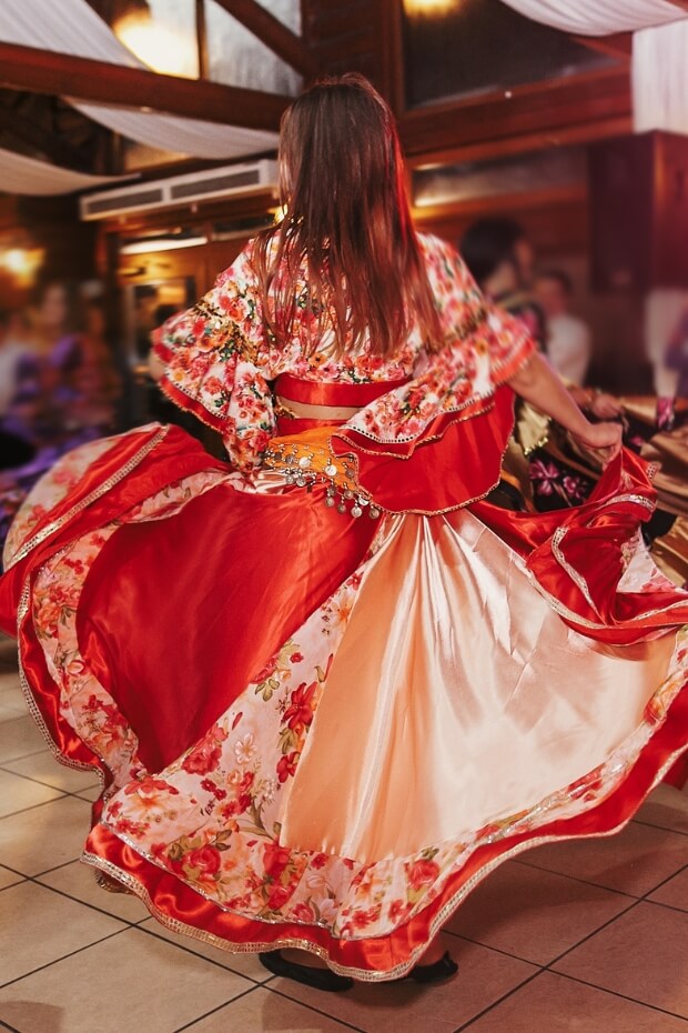 Woman in red and white dress dancing