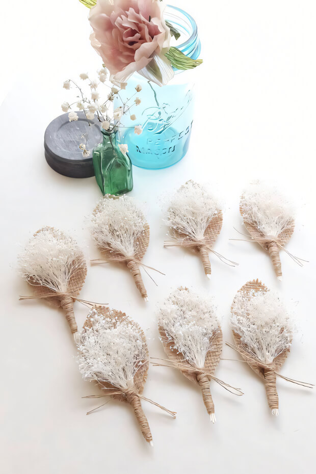 White flower boutonnieres with burlap ribbon