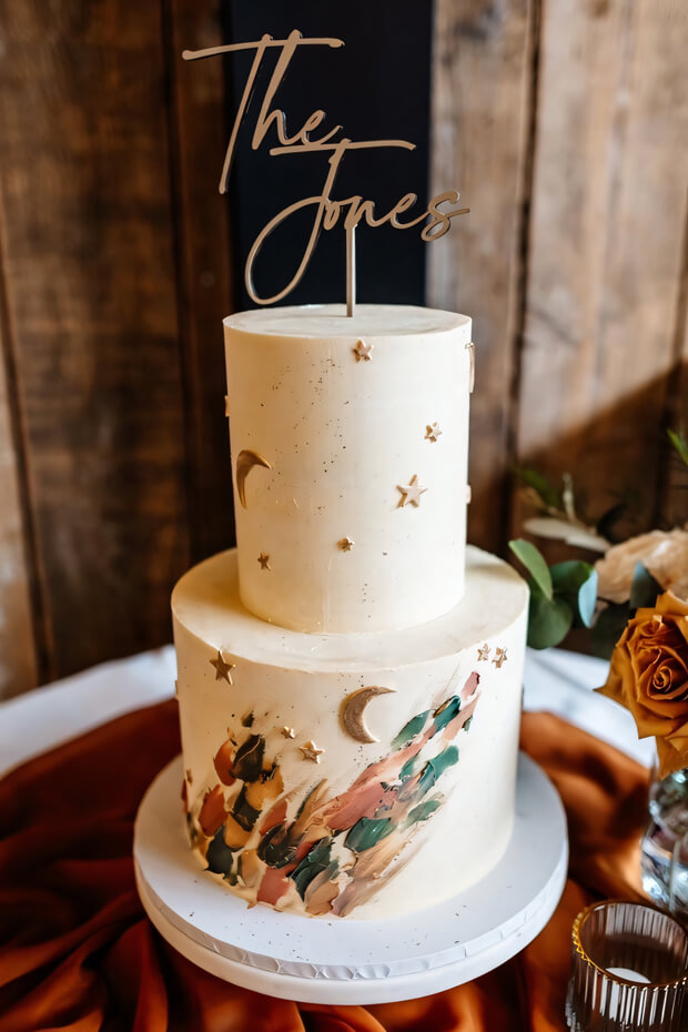 Celestial wedding cake with intricate colorful designs