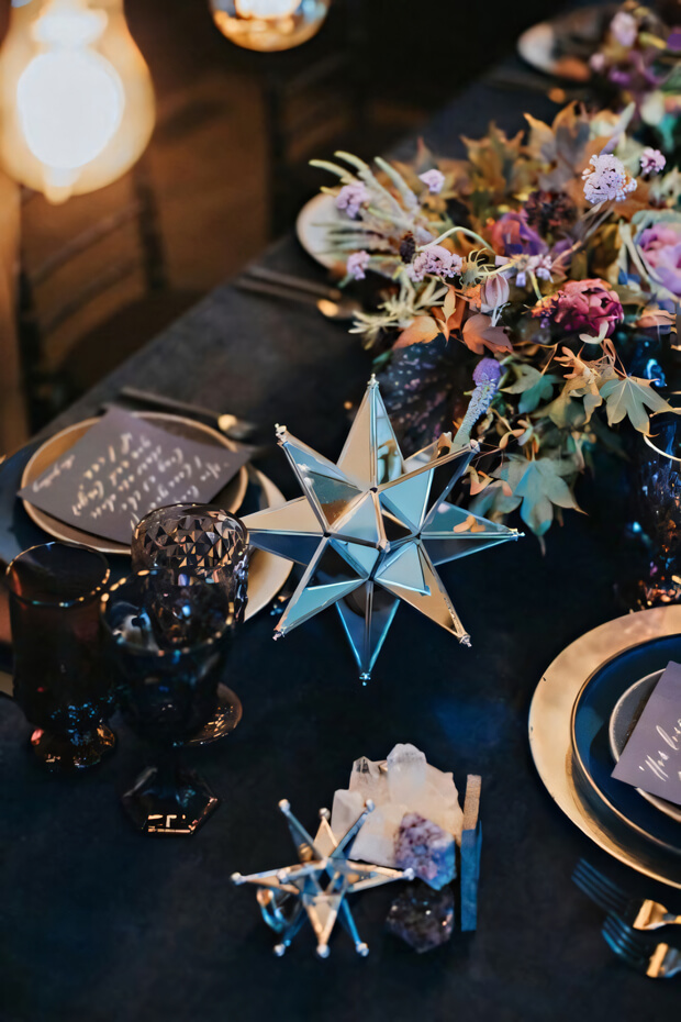 Starry wedding with dark florals and 3D mirror stars