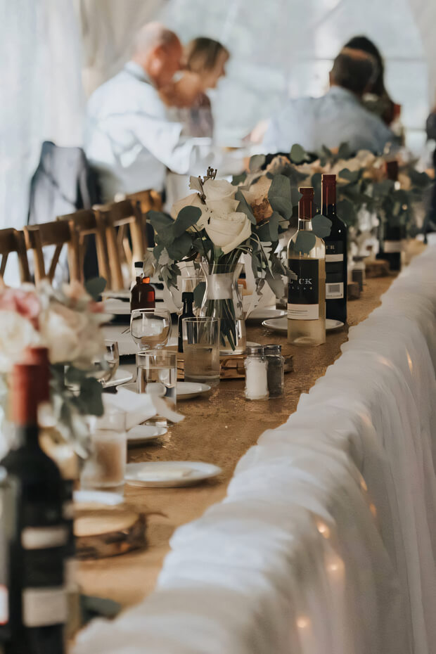 Elegant wedding table with burlap runner