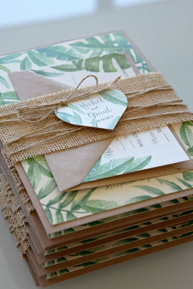 Burlap wedding invitation with green leaf pattern