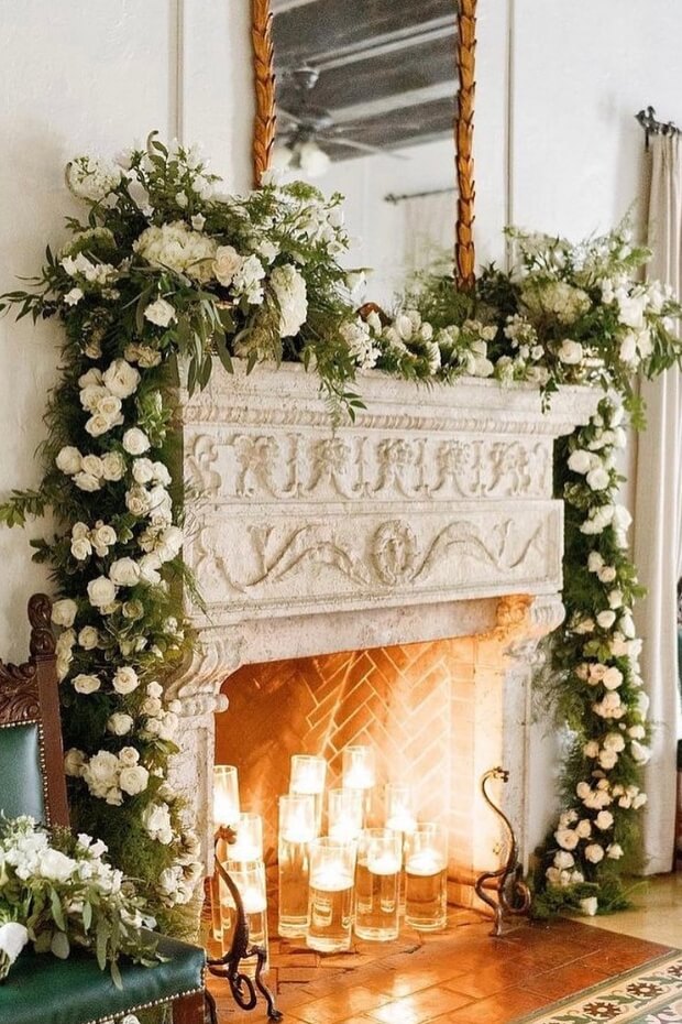 Green Garland, White Flowers, and Candles Decor