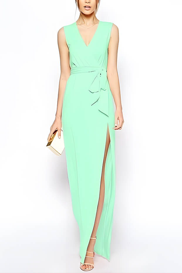 Bright green maxi dress with sash and nude strappy heeled sandals