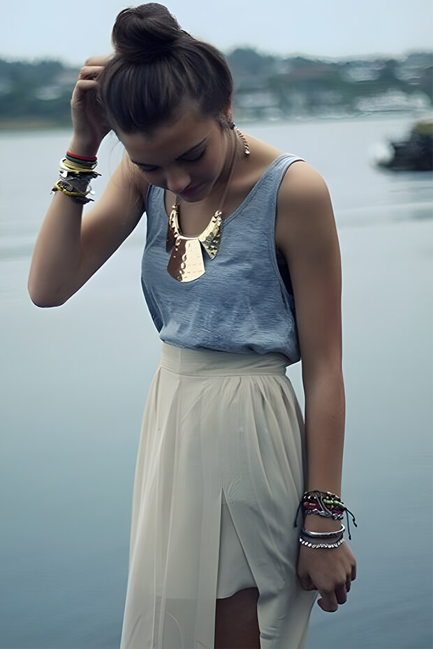 Grey top with tan high low skirt and statement necklace