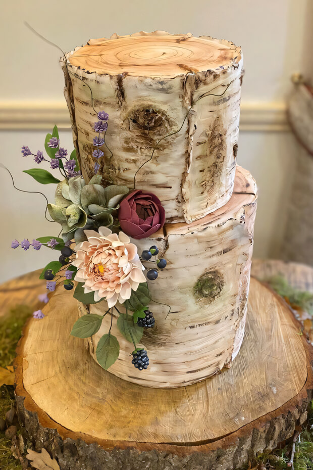 Beautiful stump cake with pink and purple flowers