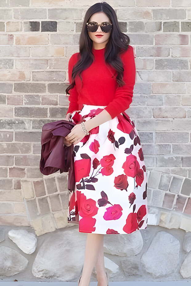 Romantic winter wedding guest outfit with floral print midi skirt